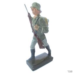 Lineol Soldier marching, rifle in front of chest