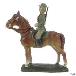 Lineol Kavallerist auf Standpferd, Gewehr auf dem Rücken
