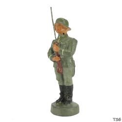 Kienel Soldier standing at attention, presenting rifle