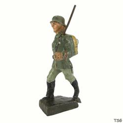 Schusso Soldier marching, rifle on shoulder