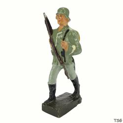 Schusso Soldier marching, rifle in front of chest