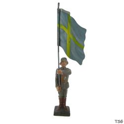 Lineol Flag bearer standing at attention, with national flag