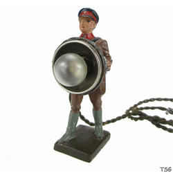 Lineol Signals soldier standing, with searchlight