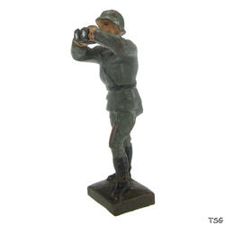 Lineol Officer standing, with binoculars