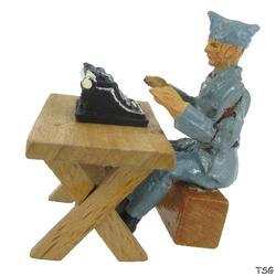 Elastolin Soldier sitting on box at table, with typewirter