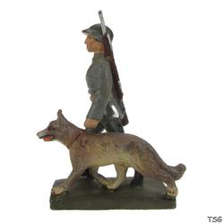 Lineol Signals soldier walking, with dog