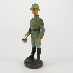 Soldier standing, with ladle
