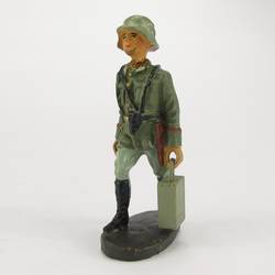 Soldier going forward with ammunition box