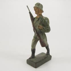 Soldier marching, rifle in front of chest