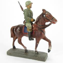 Cavalryman on horseback, rifle on the back