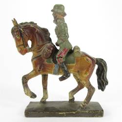 Adjutant riding on horseback, greeting