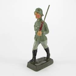 Soldier marching, rifle on shoulder