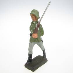 Soldier marching, rifle on shoulder