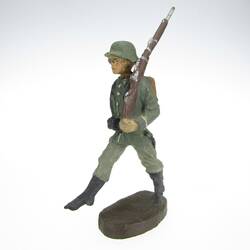 Soldier marching in goose step, rifle on shoulder