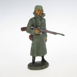 Soldier standing, rifle under the arm